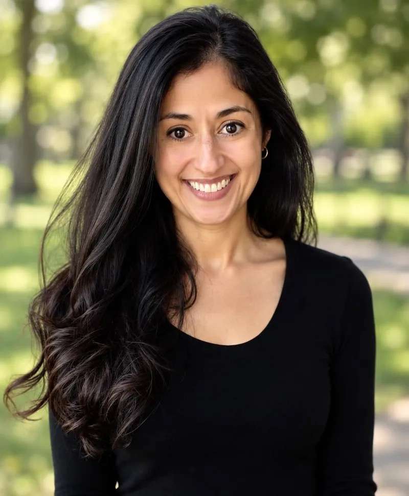 Friendly woman smiling outdoors, representing compassionate care at Peak Mental Healthcare.